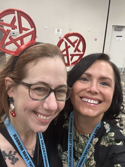 Selfie of Julie and I; Julie is in red SPN mickey ears and we both have blue CE lanyards around our necks