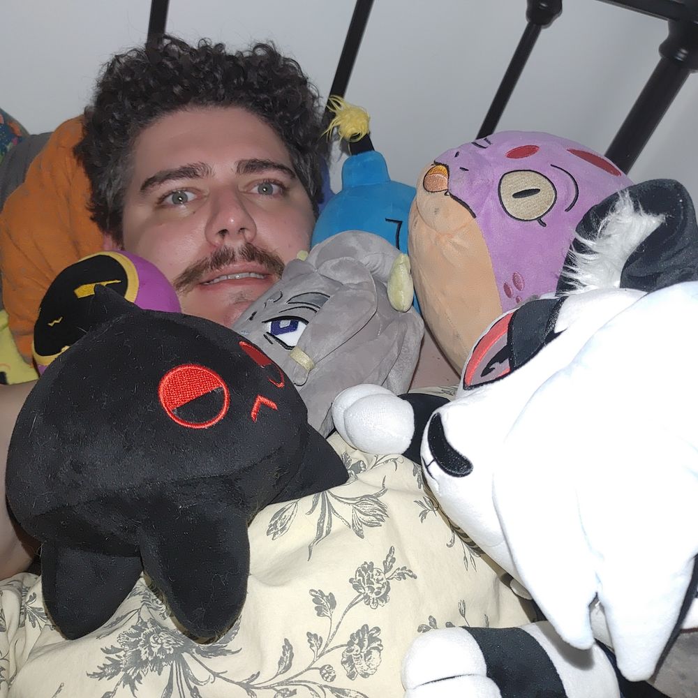 me being crushed by the weight of several plushies