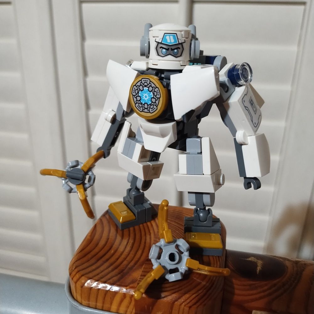 This photo reveals that the three-fingered claws from the previous photo are technically "tools" that are held in Zane's actual hands, represented by a simple clip on each arm.