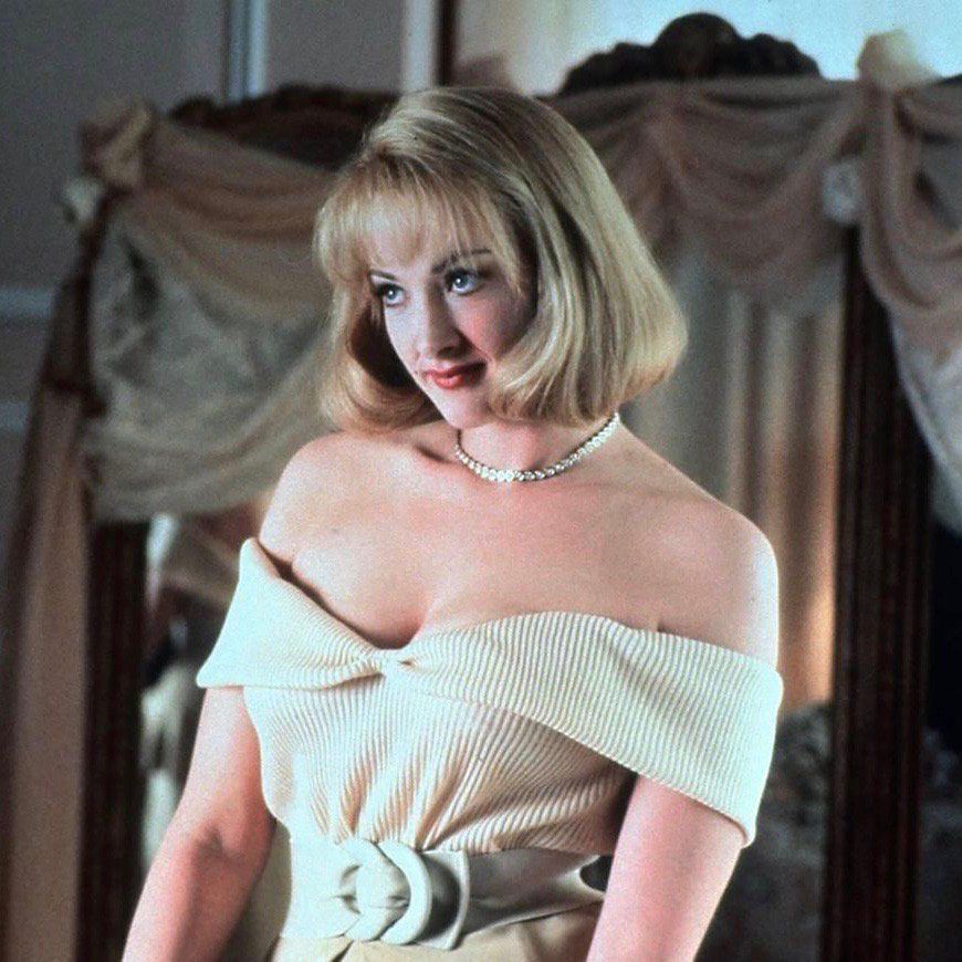 Joan Cusack as Debbie Jellinsky in Addams Family Values, looking not wholly unlike Cait. 