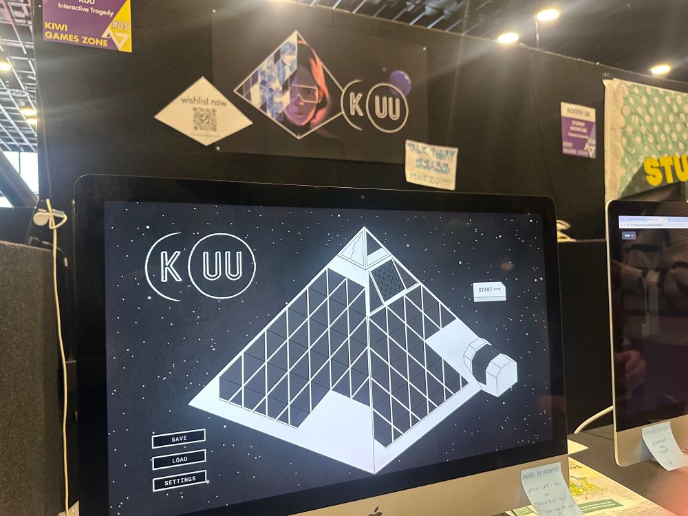 A photo of a video game called KUU, showing a highly stylised black-and-white illustration of a pyramid against a field of stars.