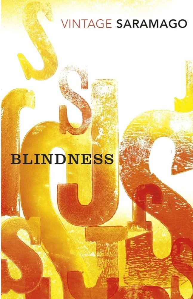 A book cover, Blindness by Jose Saramago, the illustration is letters in varying shades of orange yellows and reds on a white background 