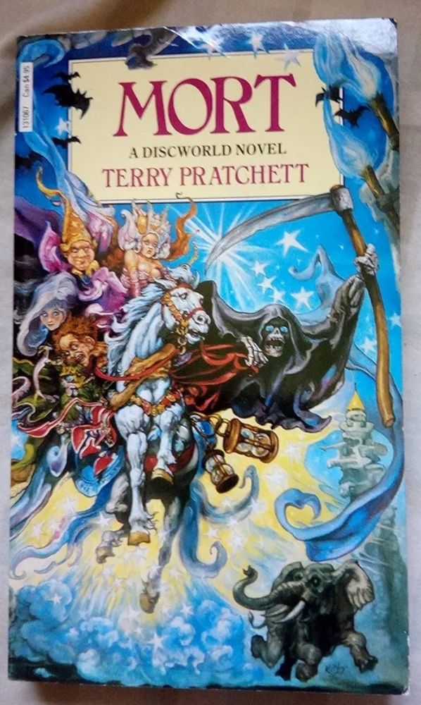 Mort by Terry Pratchett, the writing is on a beige background. There are many disc world characters in the illustration including Death holding a scythe riding a white horse, Binky