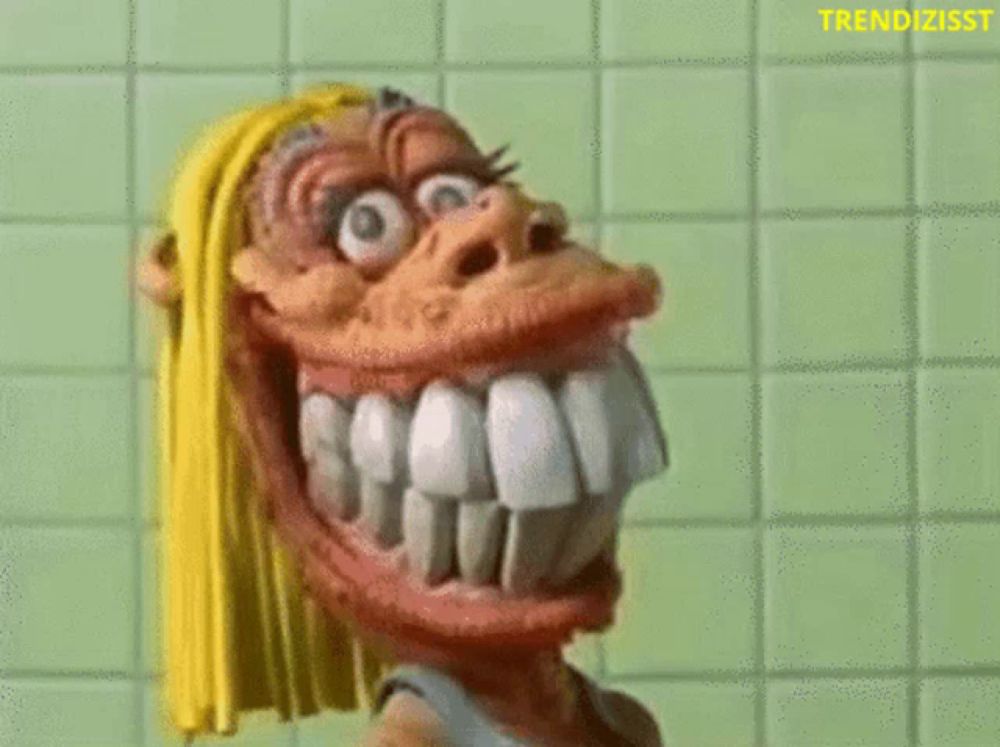 a cartoon character with big teeth is holding a toothbrush in front of a green tile wall