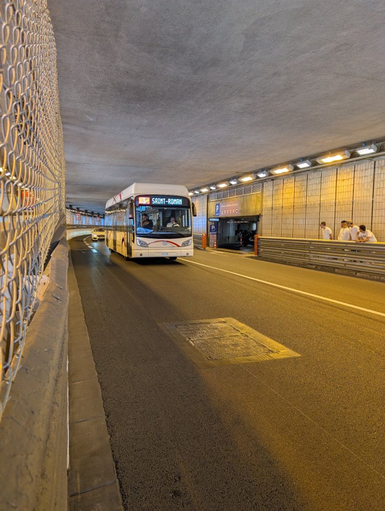 A city bus going under the Monaco tunnel.