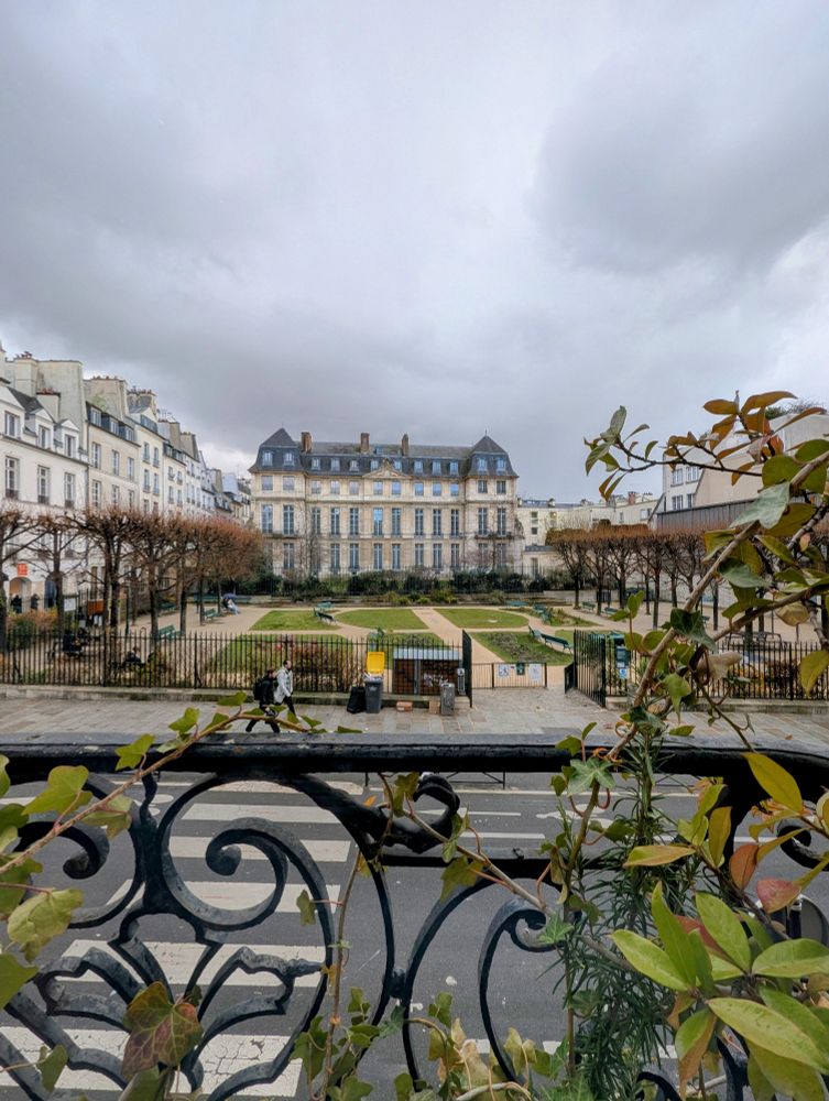 View of a Parc from the second floor window of a restaurant.