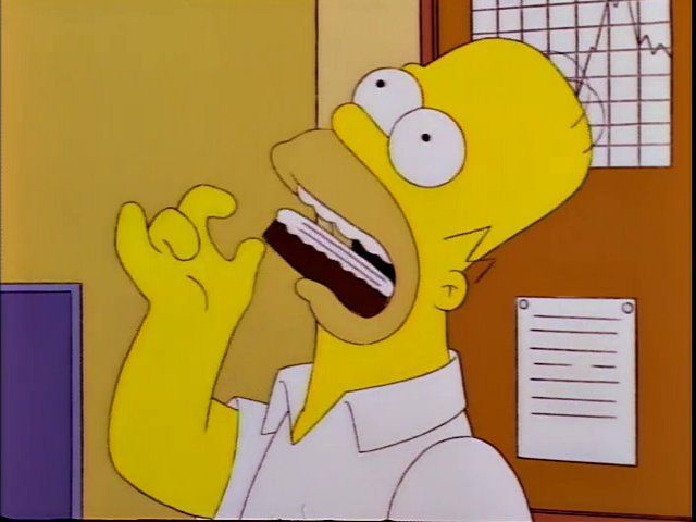 Homer Simpson shoving a pastry down his throat without chewing.
