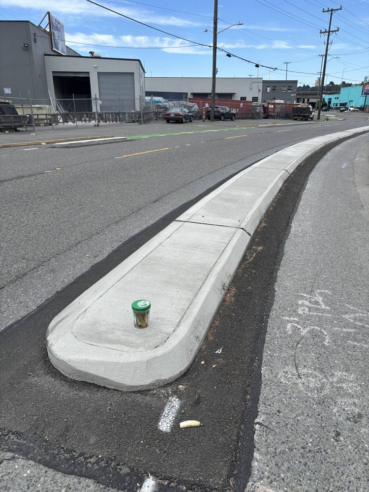 a jar of pickles on the concrete divider for the protected bike lane on the new Georgetown to Downtown safety project. see I even tied it back to urbanism!