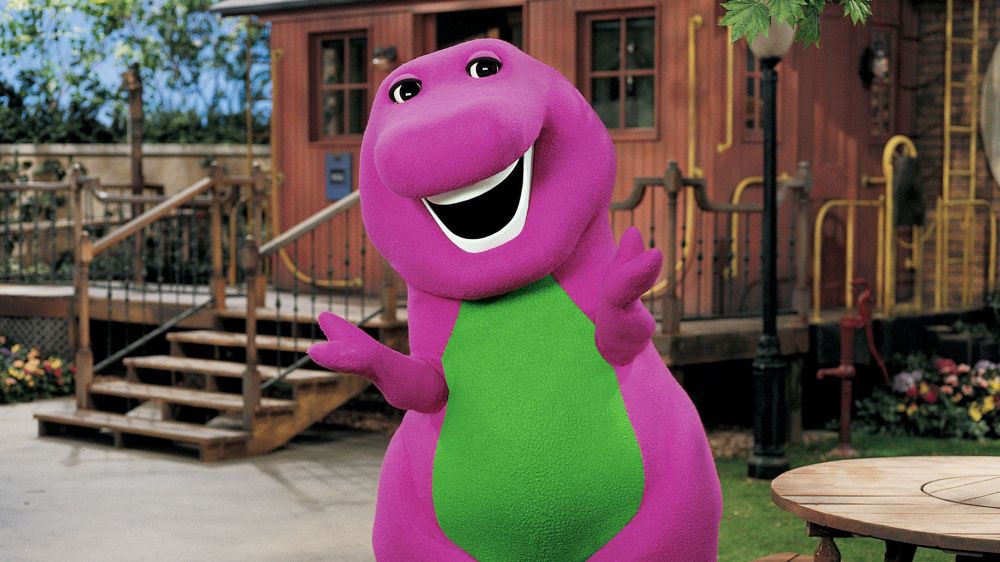 barney the dinosaur doing his lil shrug thing