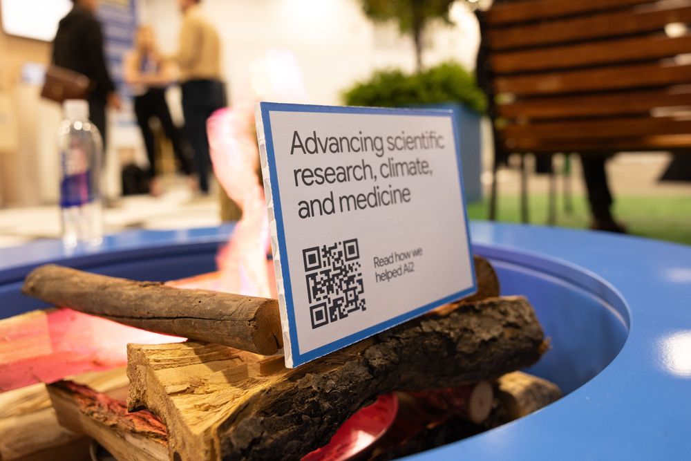A QR code leading to the story of Google Cloud and Ai2's partnership sitting near a faux fire pit.