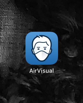 IQ Air icon that shows a masked face with blue background