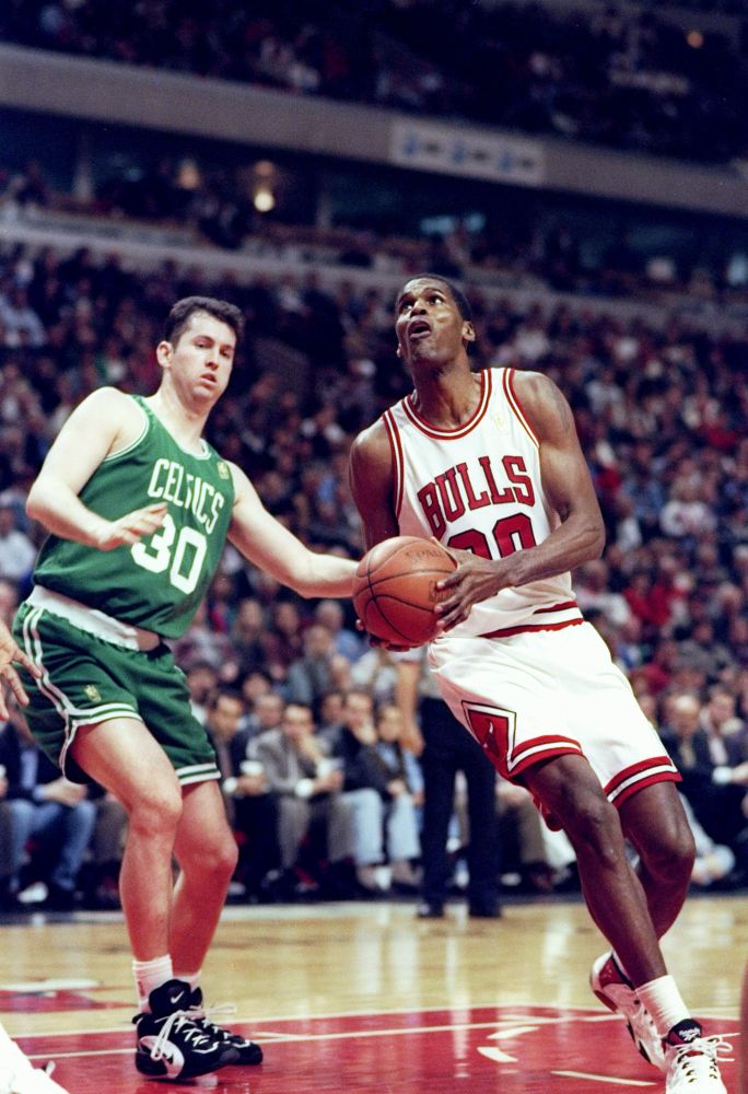 Robert Parish of the Chicago Bulls driving on Marty Conlon of the Boston Celtics. 
