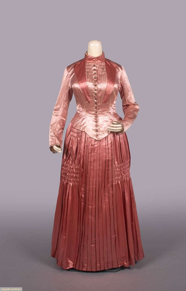 The darker pink skirt has pleating down the center front that is uninterrupted, while to either side of it is ruching at the lower thigh area. 