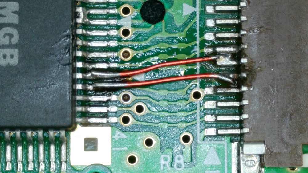Bodge wires fixing the broken ribbon connector pins in the previous photo. They’re not my best work but they get the job done. The pin pitch is pretty small!