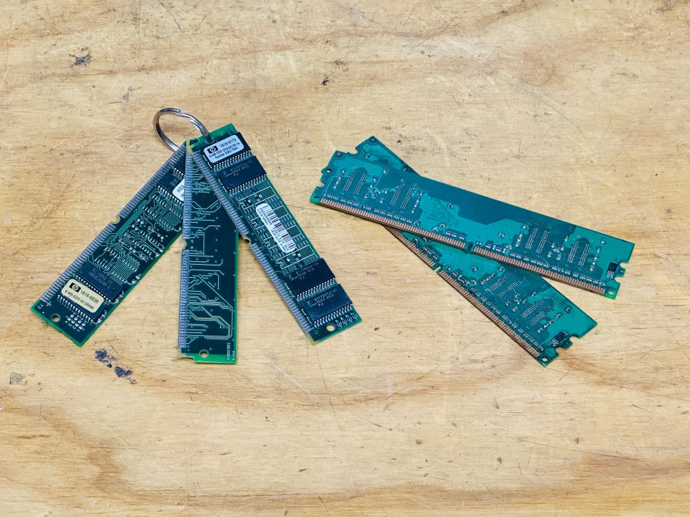 3 RAM SIMMs made into a keychain that, if put in your pocket, will stab you in the balls next to a pair of what are probably RDRAM terminators (and thus have no RAM chips on them) and no doubt will get a bunch of pedantic people to reply “tHoSe ArE rAm TeRmInAtOrS yOu IdIoT!!!!!!11!!” but little do they realize 1) I already know what they are and 2) I don’t give a shit.