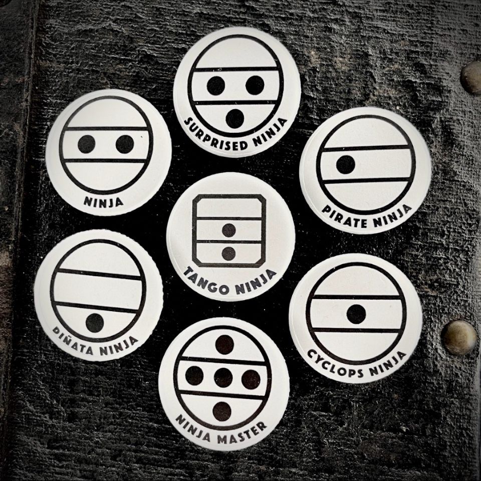 Various accordion/organ register switch symbols with their circles, dots and lines. With humorous subheadings joking on how the dots make them look like little ninja faces with various expressions. “Ninja,” “Surprized Ninja,” “Pirate Ninja” (has one eye) etc. A “Tango Ninja” has a square box around it rather than round, and the low/middle ‘bandoneon’ reed symbol).