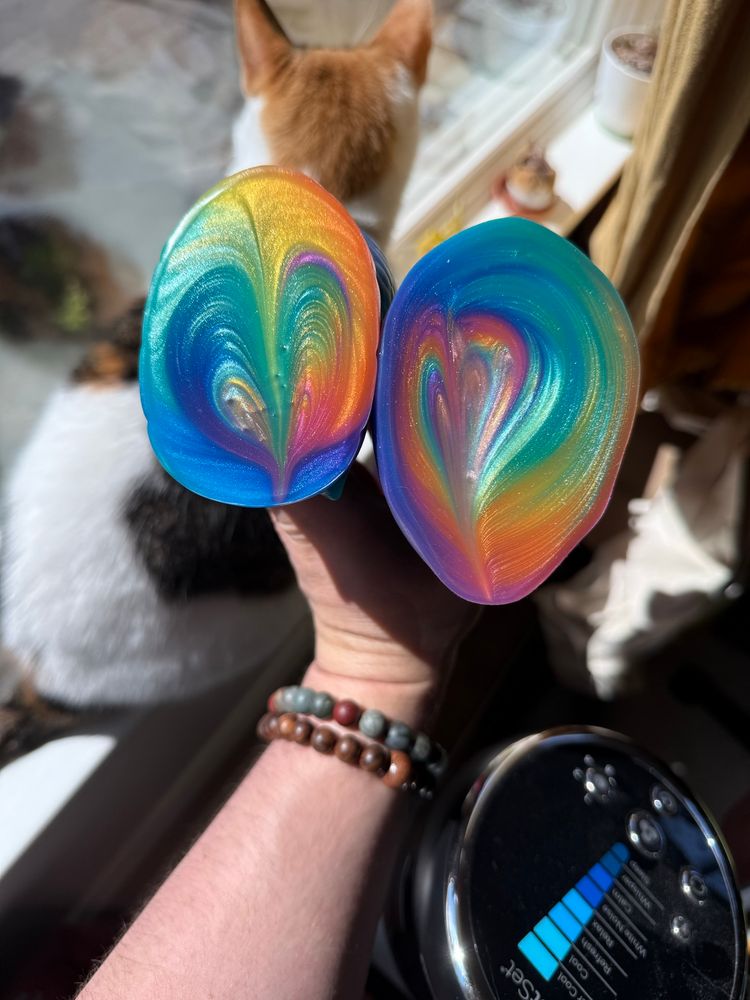 the bases of two rainbow silicone toys
