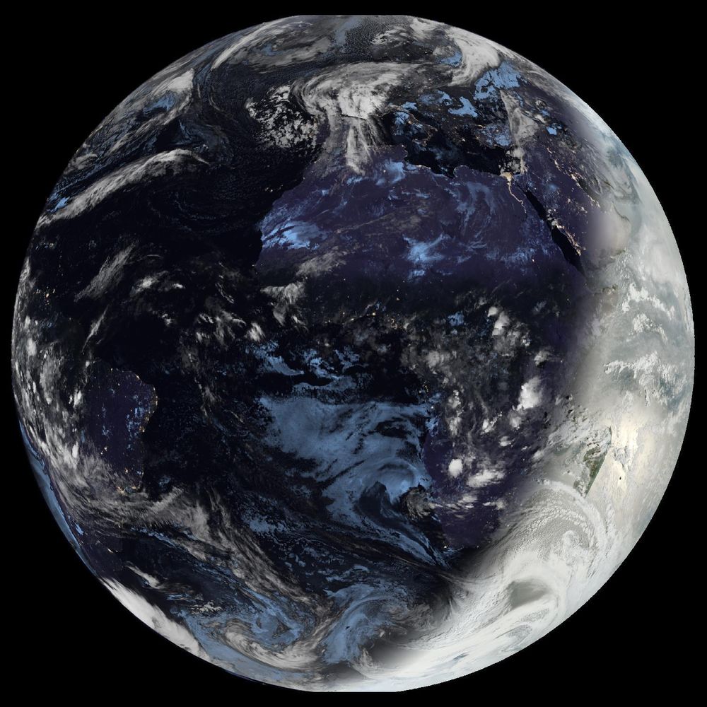 Full disk satellite view of Earth centered on Africa and Europe, with partial views of South America and the Middle East. The satellite image showing Earth from geostationary orbit, captured by EUMETSAT's Meteosat Third Generation (MTG) satellite using the GeoColor RGB composite technique. The image displays both day and night views of Earth, with the daytime portion showing true color representation of land and clouds, while the nighttime portion appears darker with visible city lights. White cloud formations are scattered across the image, particularly along the intertropical convergence zone. The image provides a full disk view of Earth, showing the planet's curvature against a black background.