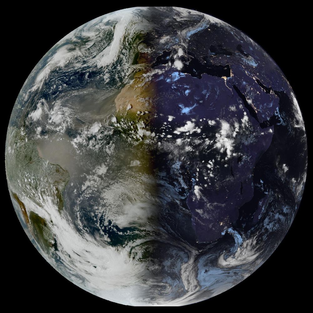 Full disk satellite view of Earth centered on Africa and Europe, with partial views of South America and the Middle East. The satellite image showing Earth from geostationary orbit, captured by EUMETSAT's Meteosat Third Generation (MTG) satellite using the GeoColor RGB composite technique. The image displays both day and night views of Earth, with the daytime portion showing true color representation of land and clouds, while the nighttime portion appears darker with visible city lights. White cloud formations are scattered across the image, particularly along the intertropical convergence zone. The image provides a full disk view of Earth, showing the planet's curvature against a black background.