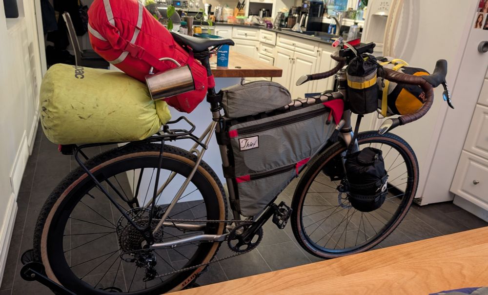 Side view of bike loaded with bags, ready for bikepacking. 