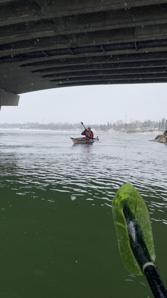 Me under a bridge in a kayak on the South Saskatchewan River in Saskatoon.
