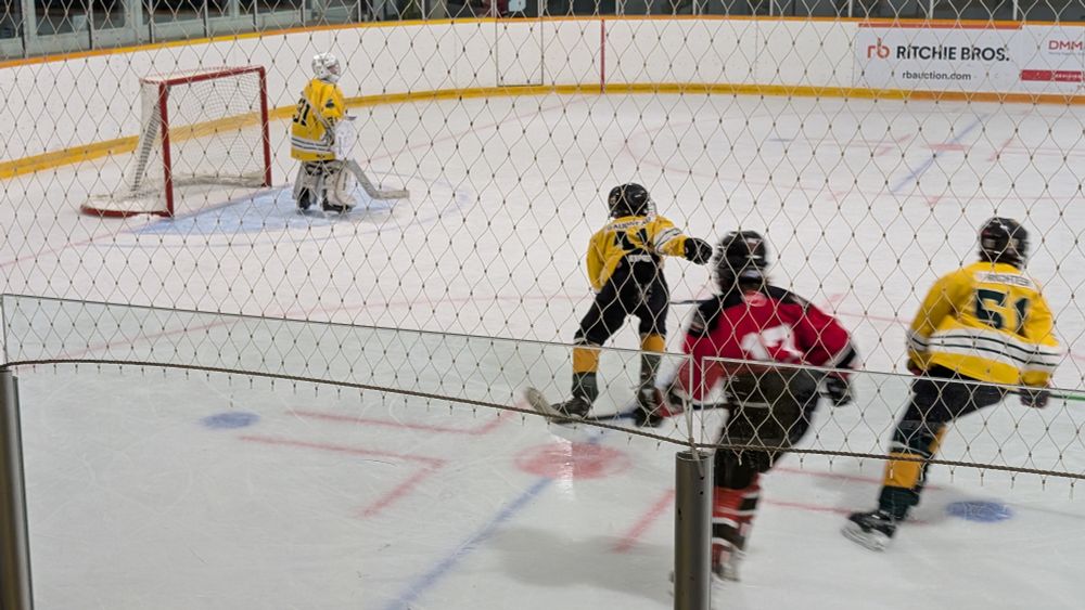 Kids playing hockey. My nephew is in net. 