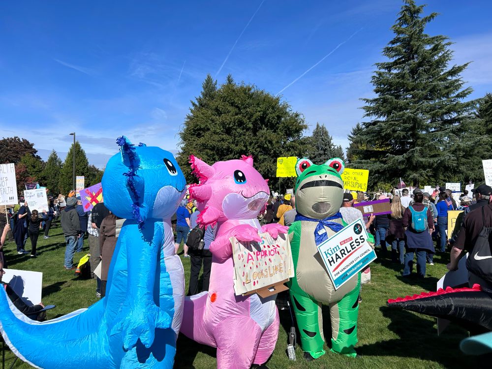 More inflatable creatures holding signs. 