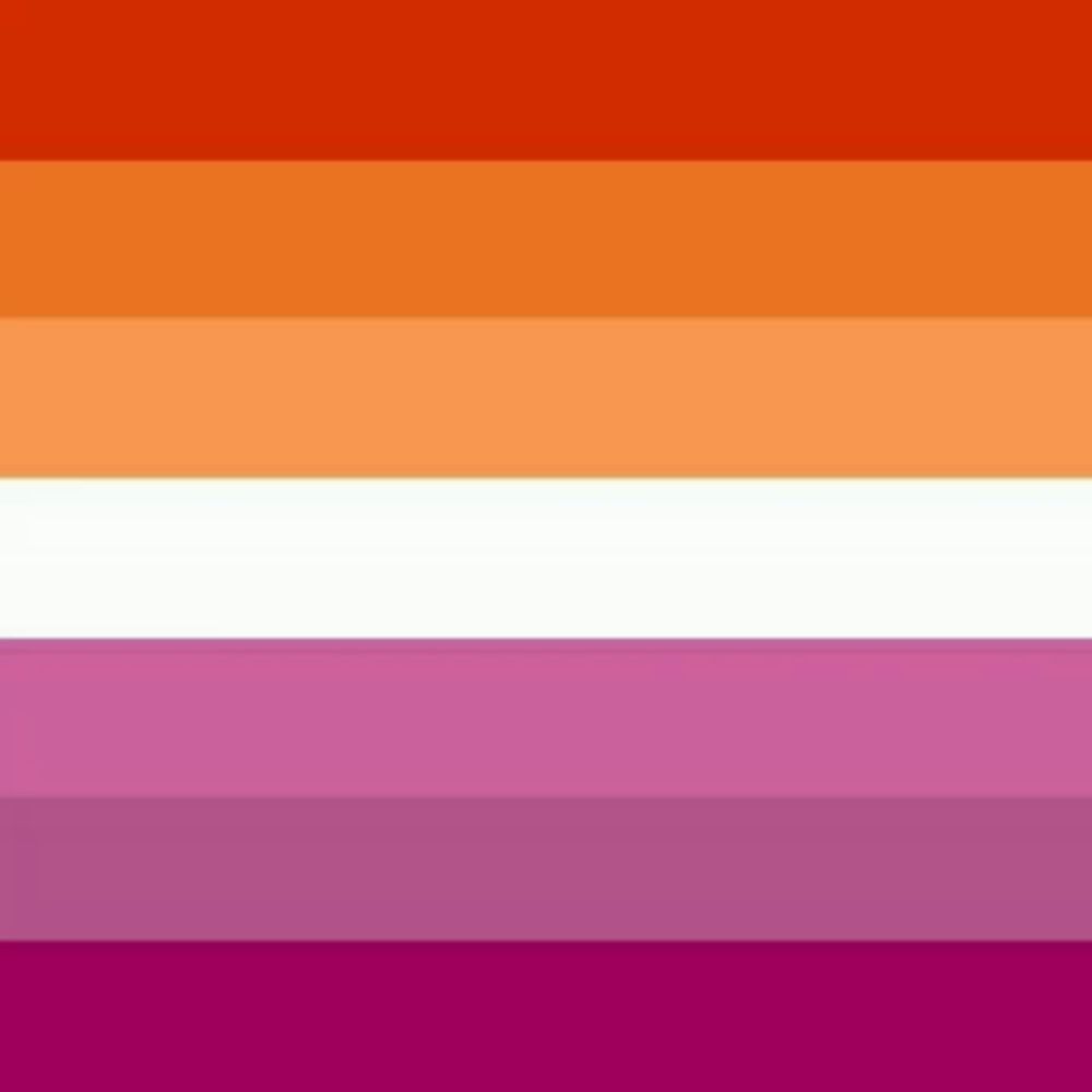 a lesbian flag with orange , purple , and white stripes .