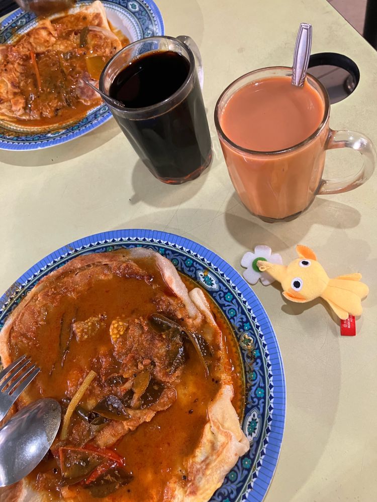 Roti Prata with curry alongside coffee, tea and pikmin.
