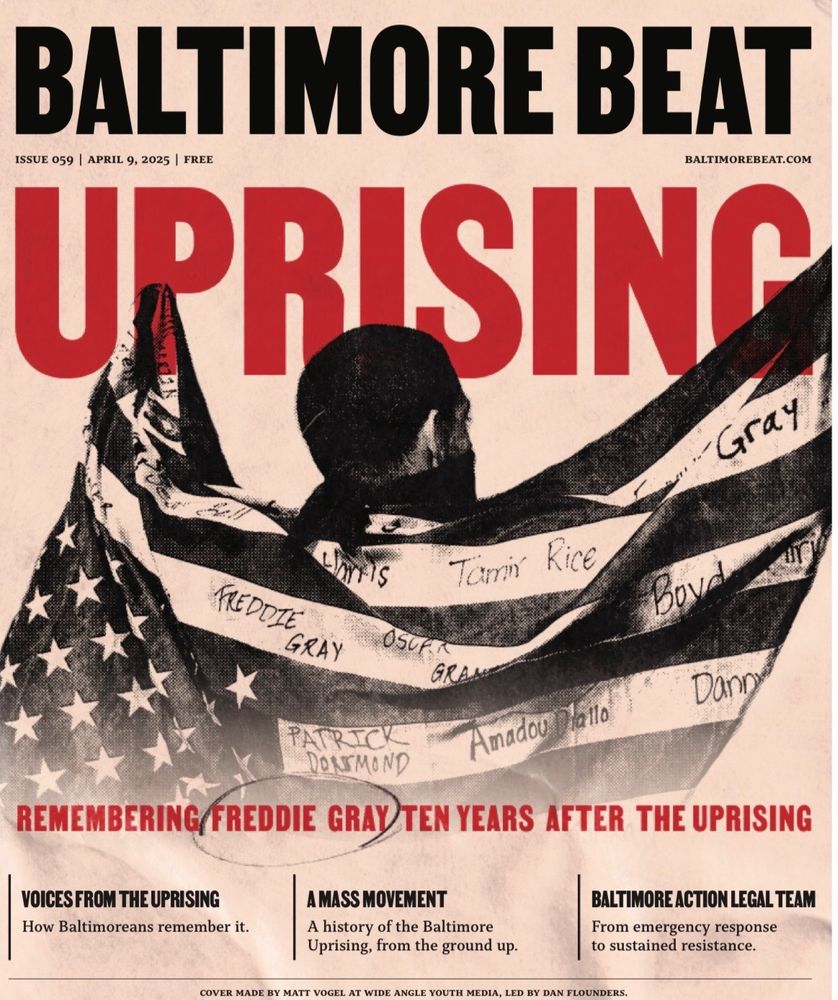 This is an image of issue 59 of Baltimore Beat. It is a photo of a man holding an American flag. Above the man’s head is the word “uprising” in red text.