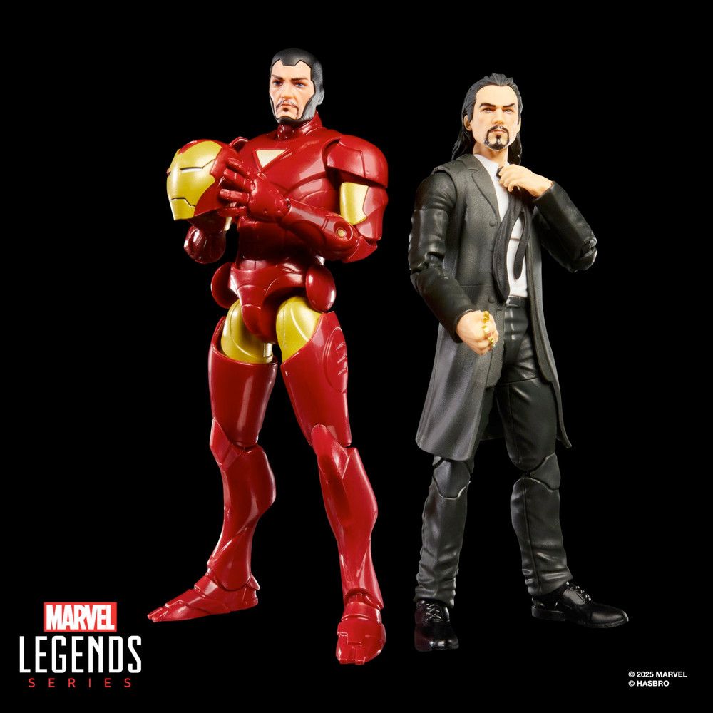 Iron Man Extremis armor unmasked and a guy with a long hair and a goatee in a black suit with a mid-length jacket and messy tie.