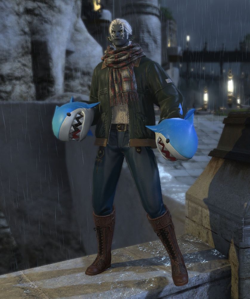 My elezen Duathire with his new monk weapons, a pair of shark heads, complete with chomping action. He looks very pleased about them.