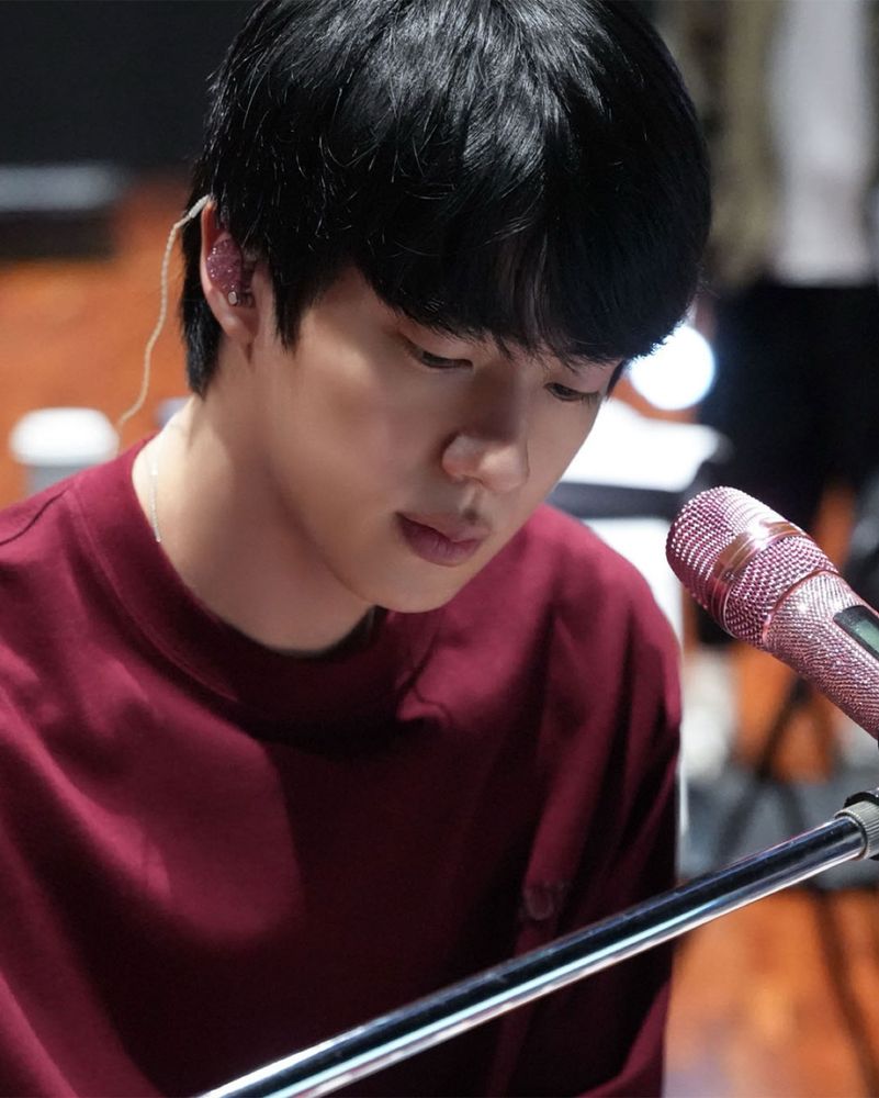 BTS Jin the movie image - Jin in maroon sweater and pink mic 😩
