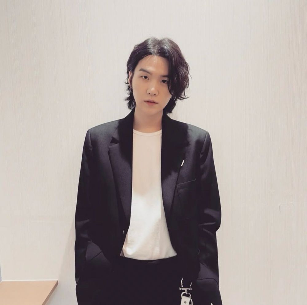 Yoongi in black sports jacket and pants with white t shirt 