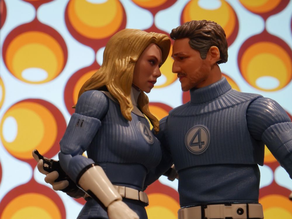 Photo of Reed Richards and Susan Storm action figures with a 60s background.