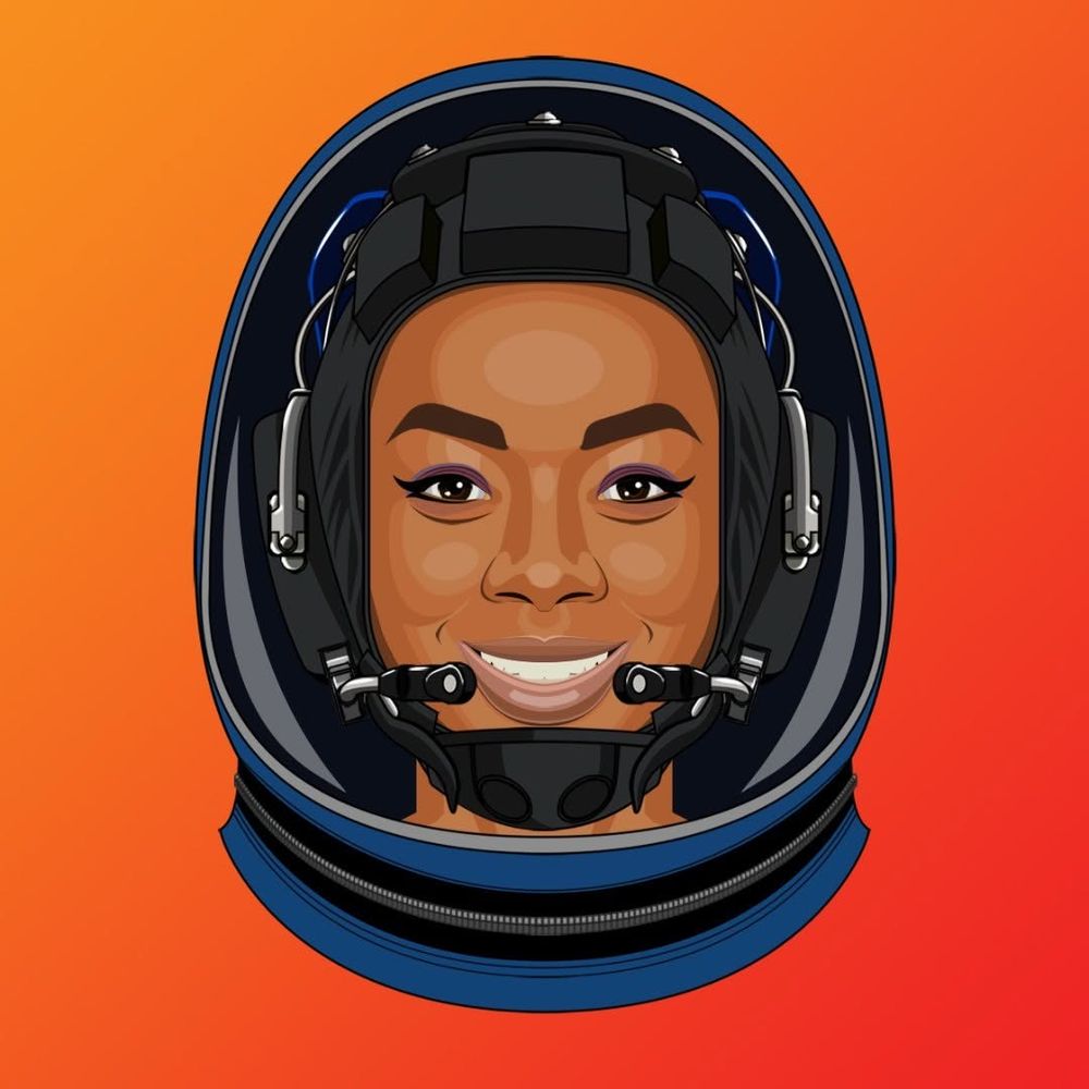 A smiling woman wearing a blue Boeing spacesuit with zipped and sealed visor assembly.