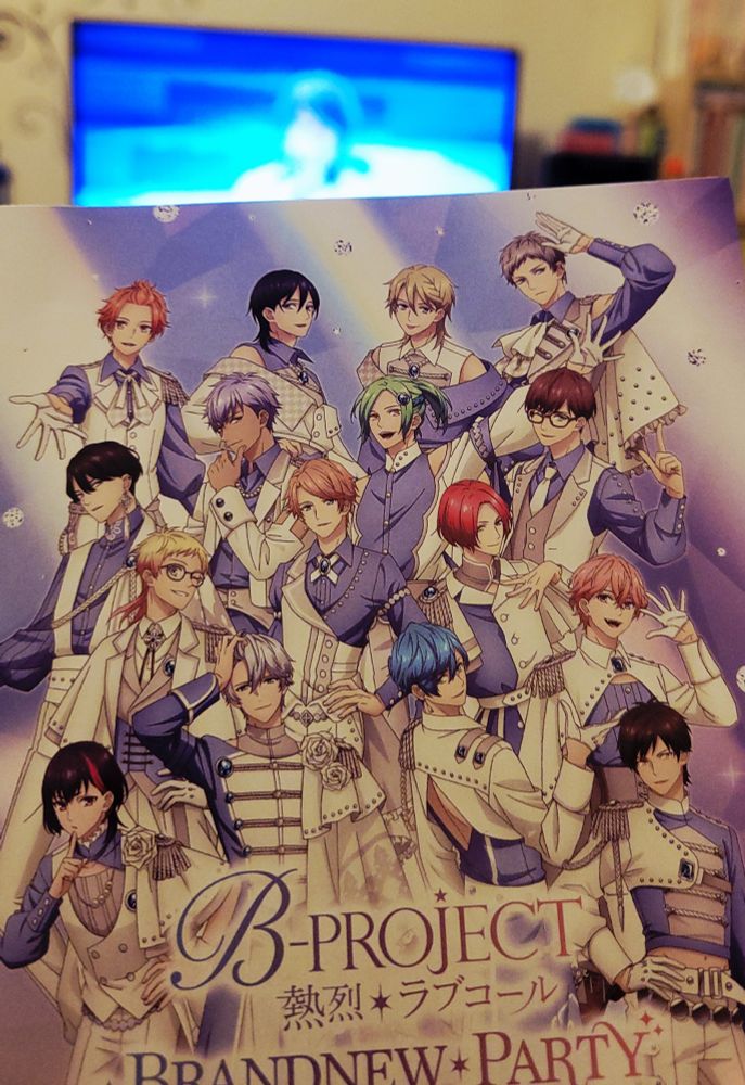 Booklet for the concert blu-ray for Brand New Party (B-Project), in the background it's on the tv (but really blurry... but trust me, it's Ono Daisuke)