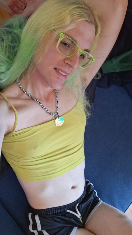 Paradox laid back on the couch, wearing shorts and a crop top