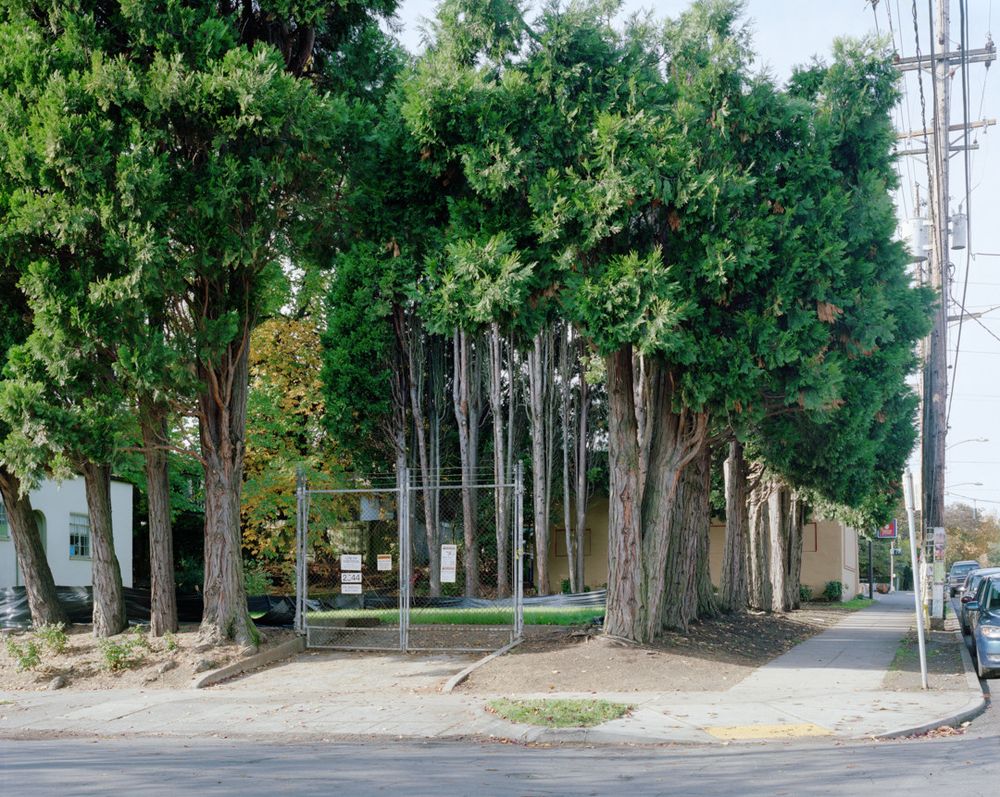The city corner lot that previously held the substation pictured in the other image in this post is now an empty space.  A gate into the lot now stands unconnected to any fencing.