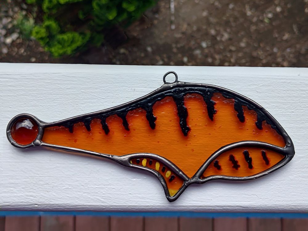 Same glass piece, but rested on a white railing.
