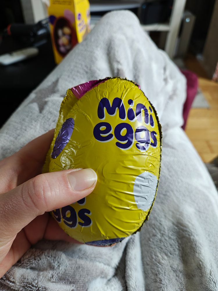 Pov wearing pj's holding a mini eggs Easter egg