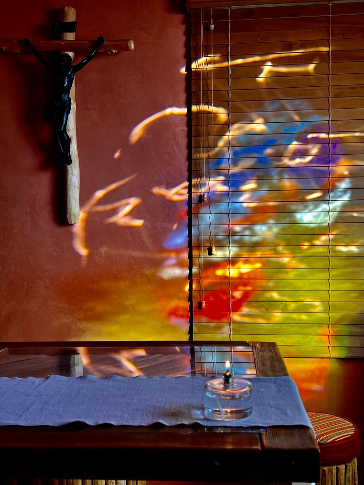 Multicolored swirl on a wall behind an altar