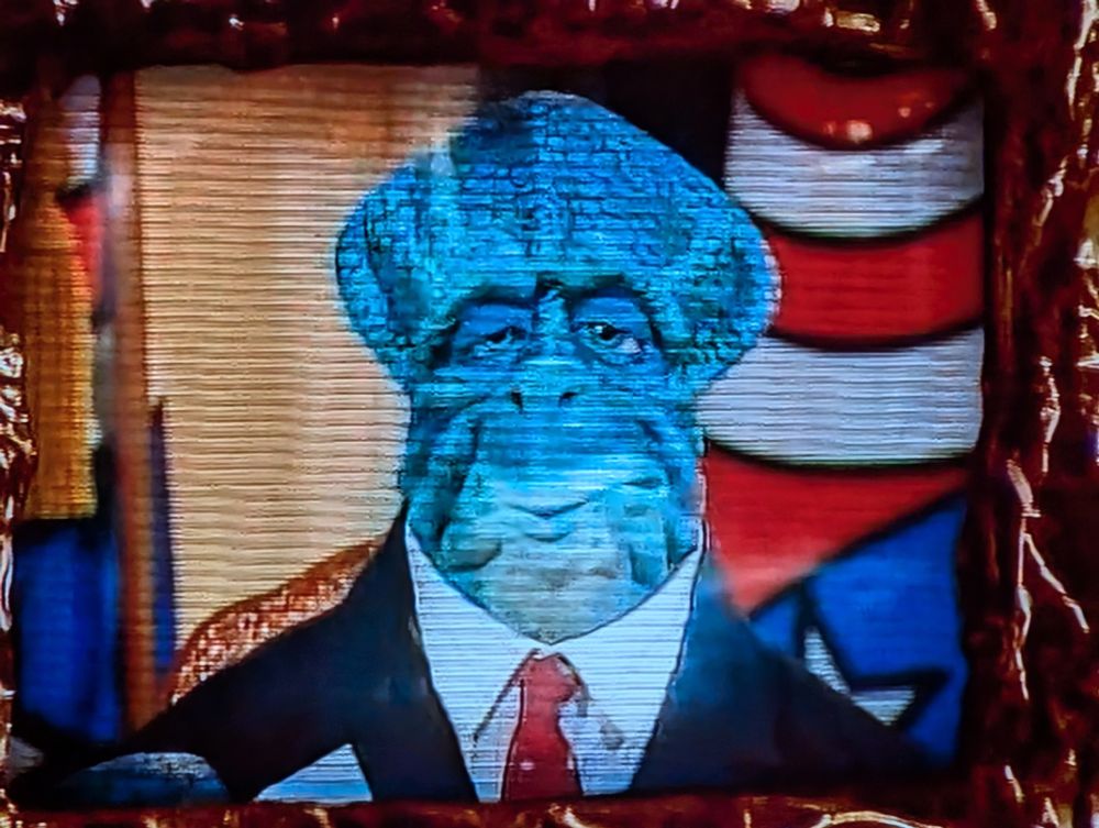 a screenshot of The Elder (basically U.S. president) from the 90's TV show "Dinosaurs" 
