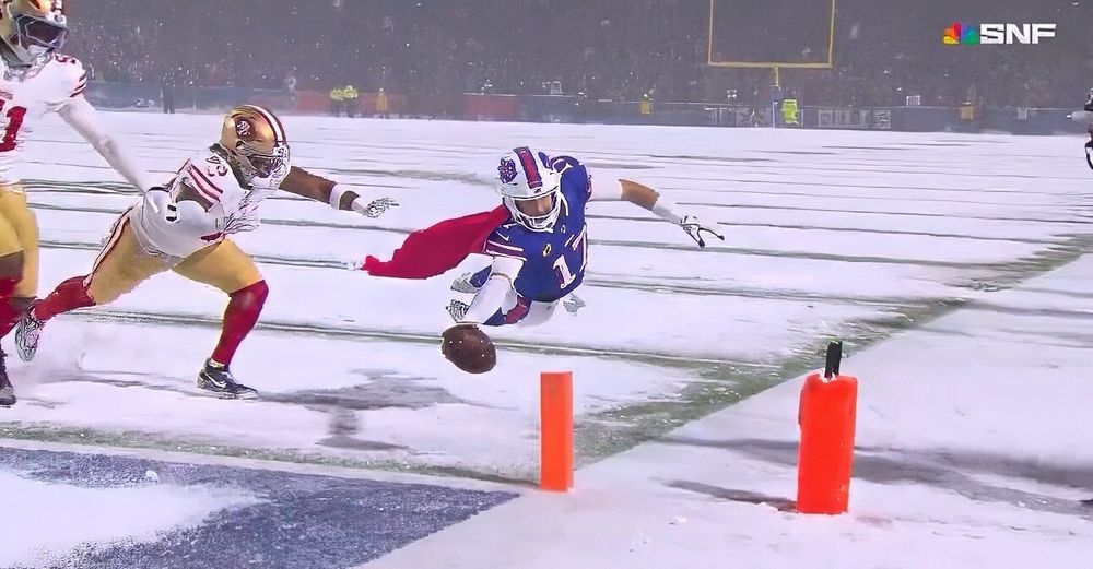 Josh Allen flying in for a TD looking like Superman, wearing a cape.