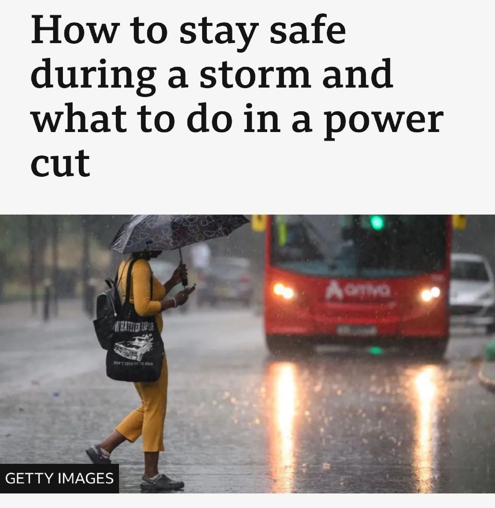 Screenshot if bbc news article showing the headline “How to stay safe during a storm and what to do in a power cut” the photo underneath shows someone walking across a road in the pouring rain. There is a bus beyond heading their way. 