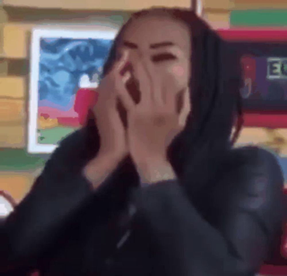 a blurry picture of a woman covering her face with her hands in front of a picture that says 30