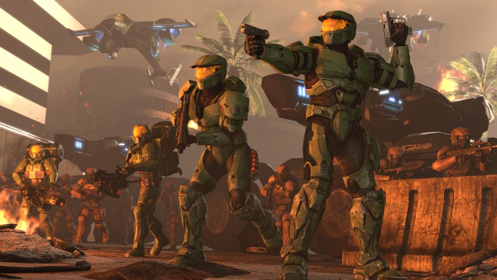 Two Mark IV Spartans and Hellbringers move out from a defensive line of Marines and Cobras. Two Sparrowhawks fly in behind them.