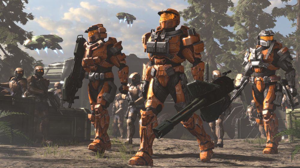 Three orange Mark IV Spartans walking away from a UNSC base, surrounded by Marines. Darters land at the base behind them.