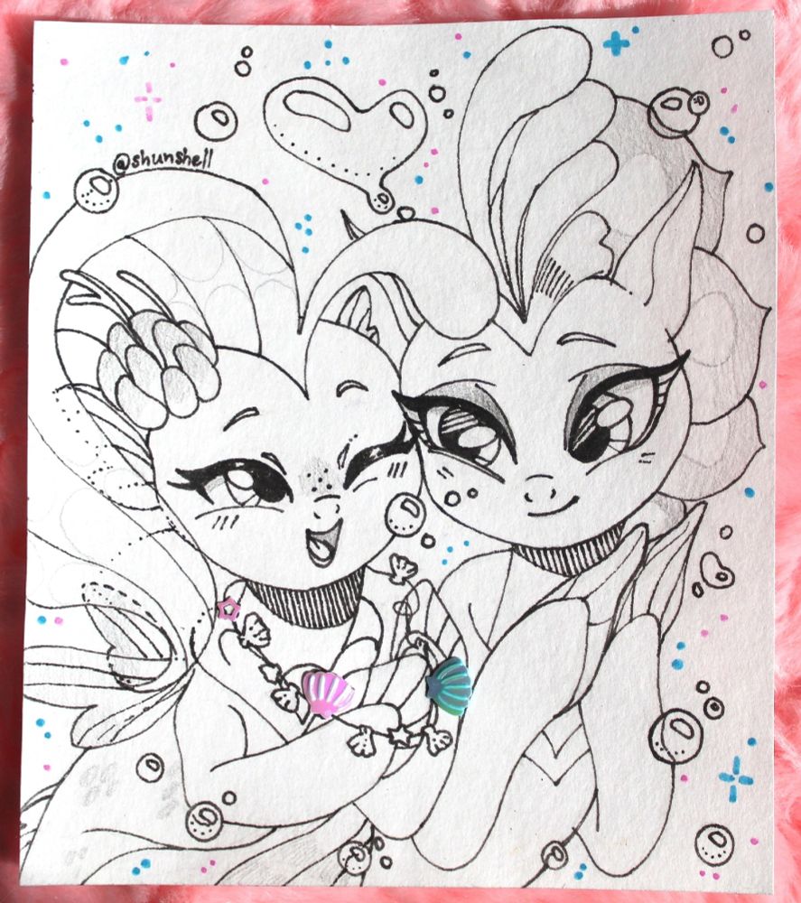 Queen Novo and her daughter, Princess Skystar, enjoying a bonding moment over a necklace of sea shells. The art was created by Shunshell from VK. It is drawn using super thin markers.