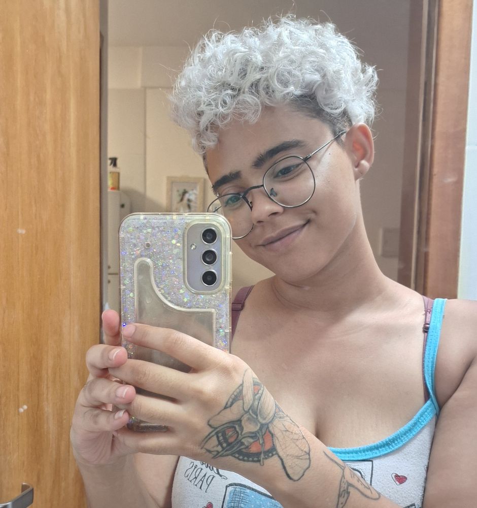 me holding up my phone in front of a mirror